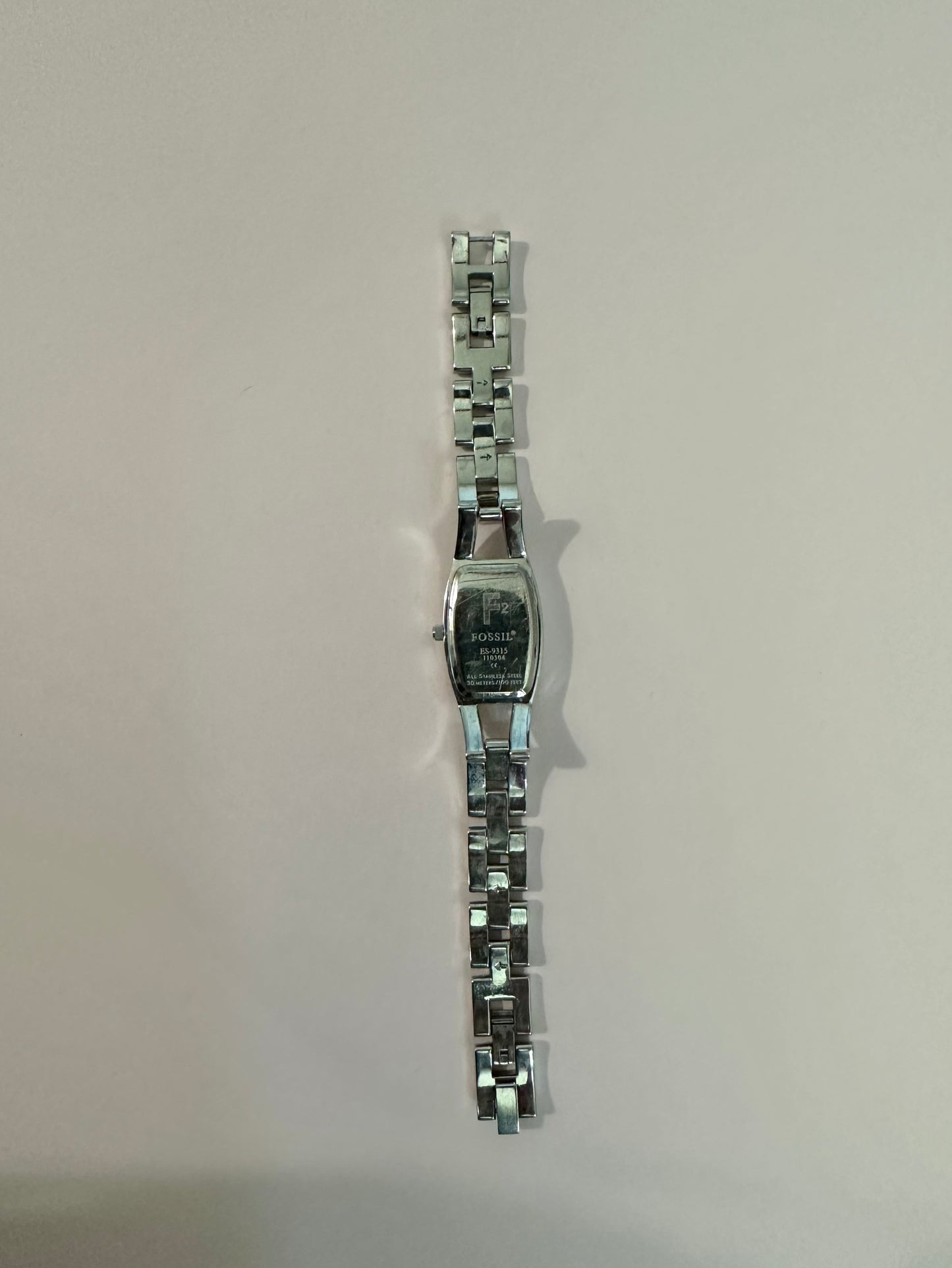 Silver Fossil band with purple face 7inches